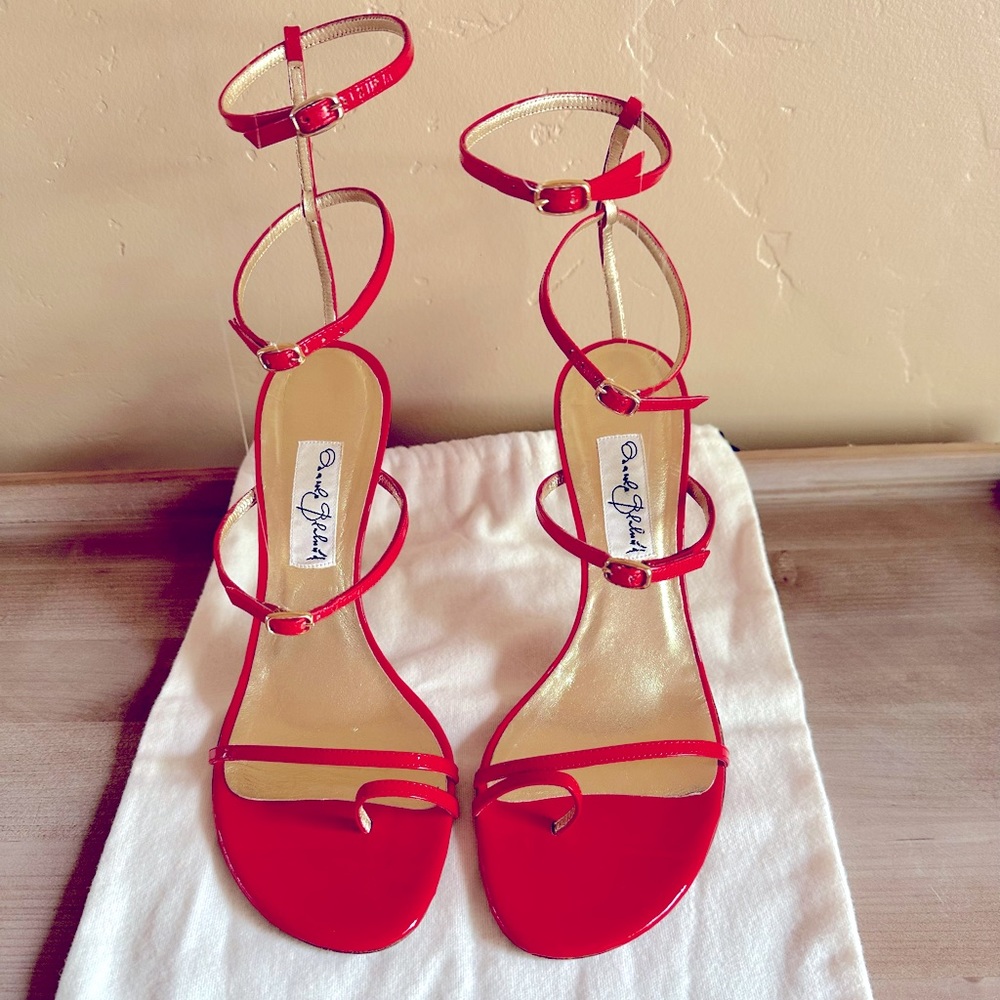 Manolo Blahnik red strapped heals